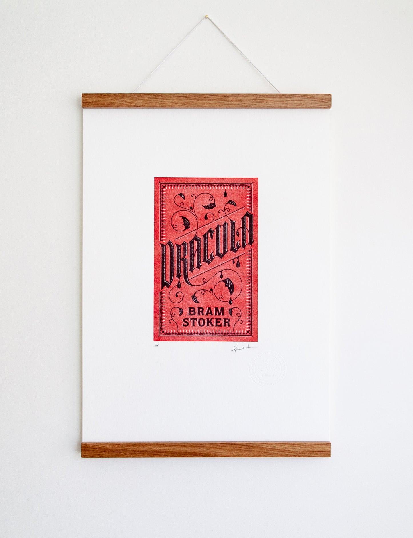 Framed 2-color letterpress print in red and black. Printed artwork is an illustrated book cover of Dracula including custom hand lettering.