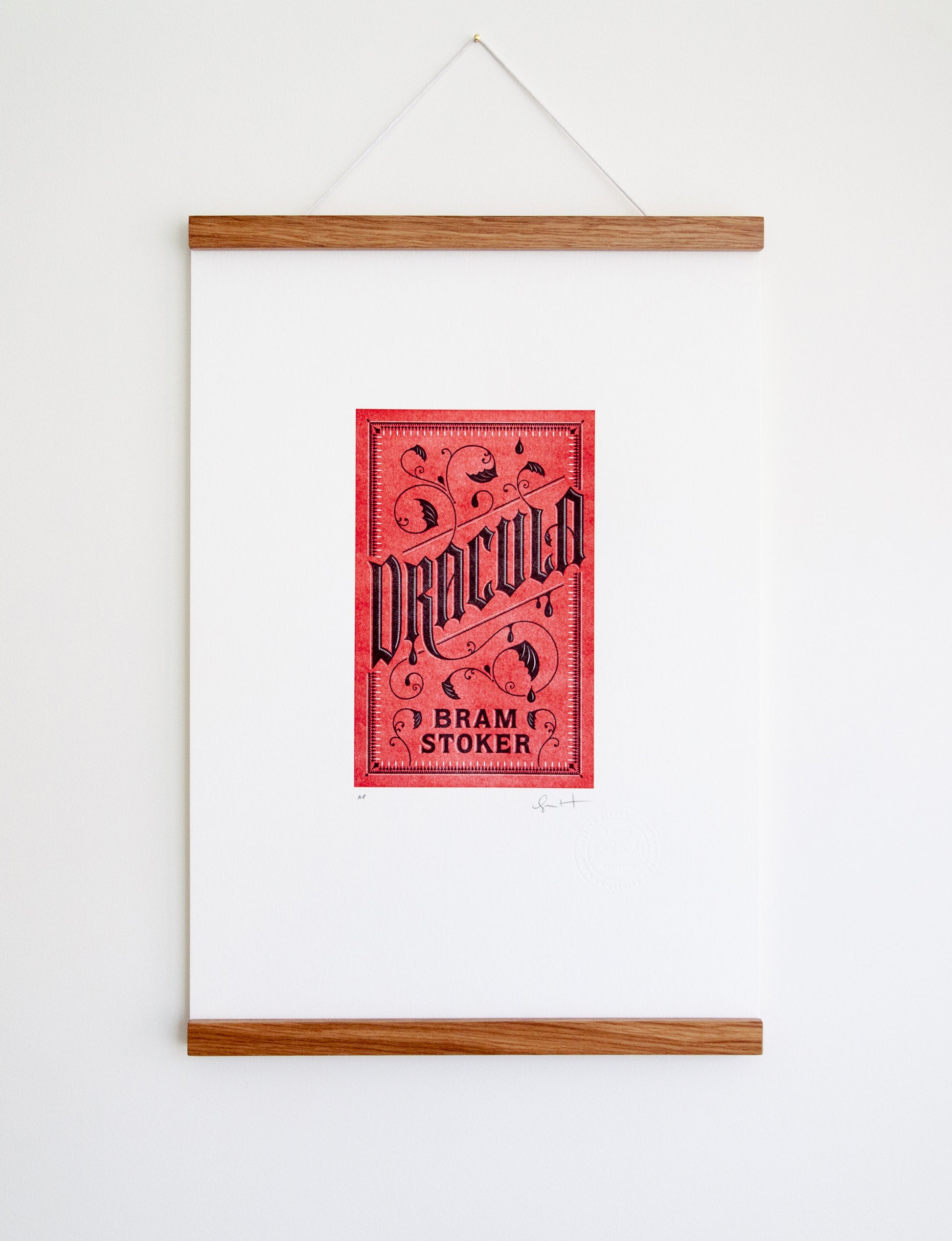 Framed 2-color letterpress print in red and black. Printed artwork is an illustrated book cover of Dracula including custom hand lettering.