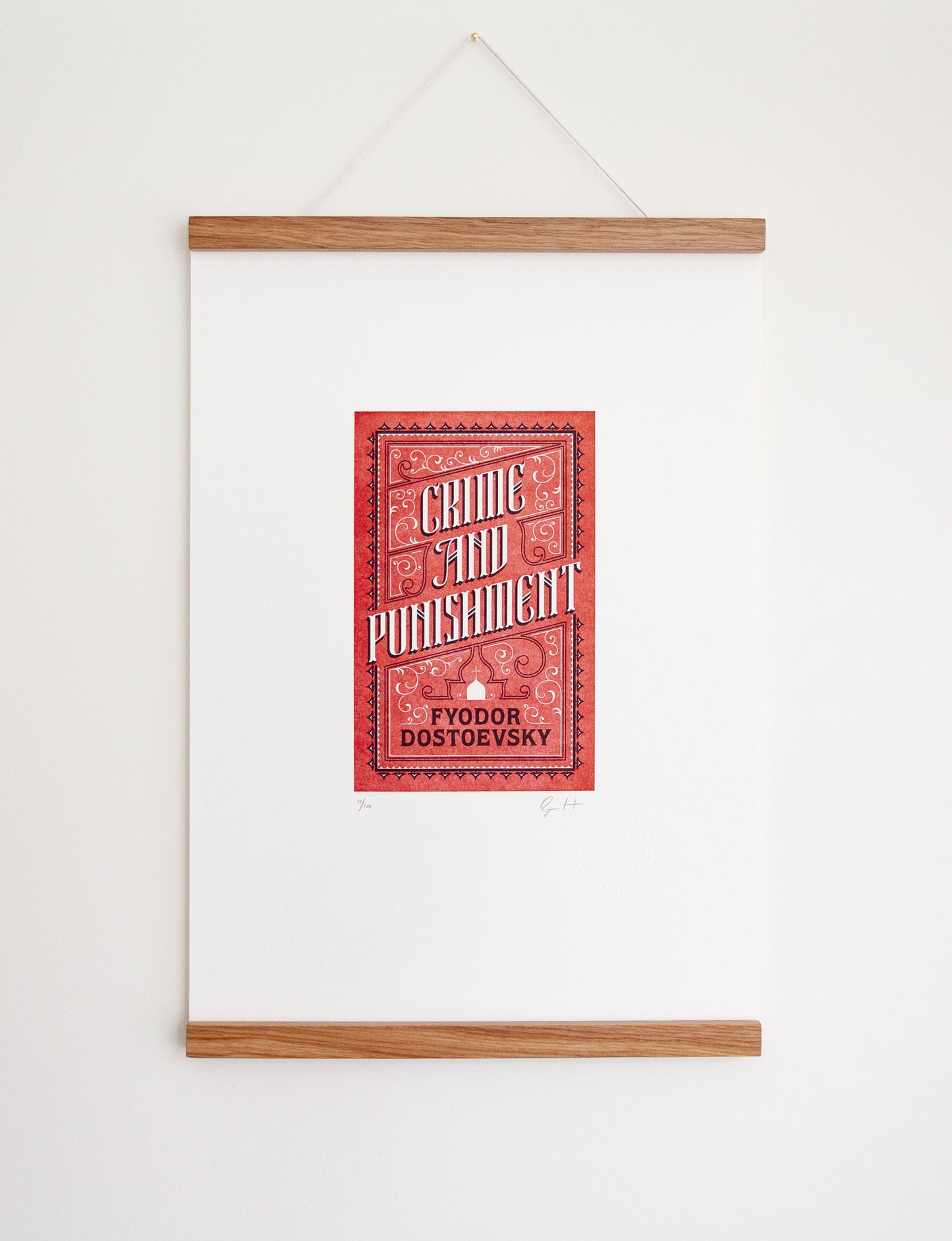 Framed 2-color letterpress print in red and black. Printed artwork is an illustrated book cover of Crime and Punishment including custom hand lettering.