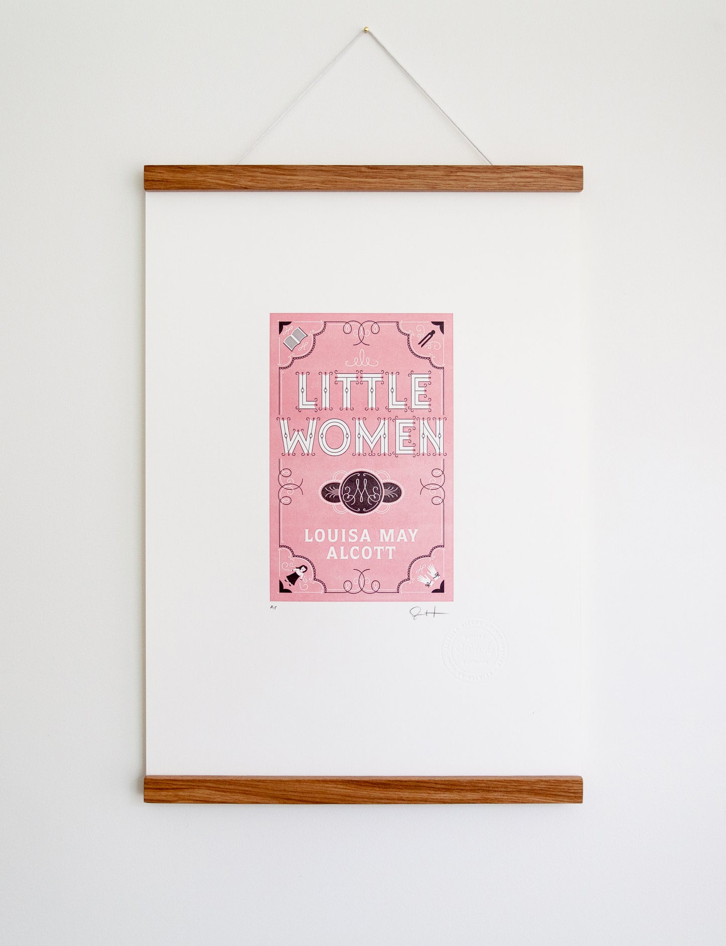 Framed 2-color letterpress print in pink and black. Printed artwork is an illustrated book cover of Little Women including custom hand lettering.