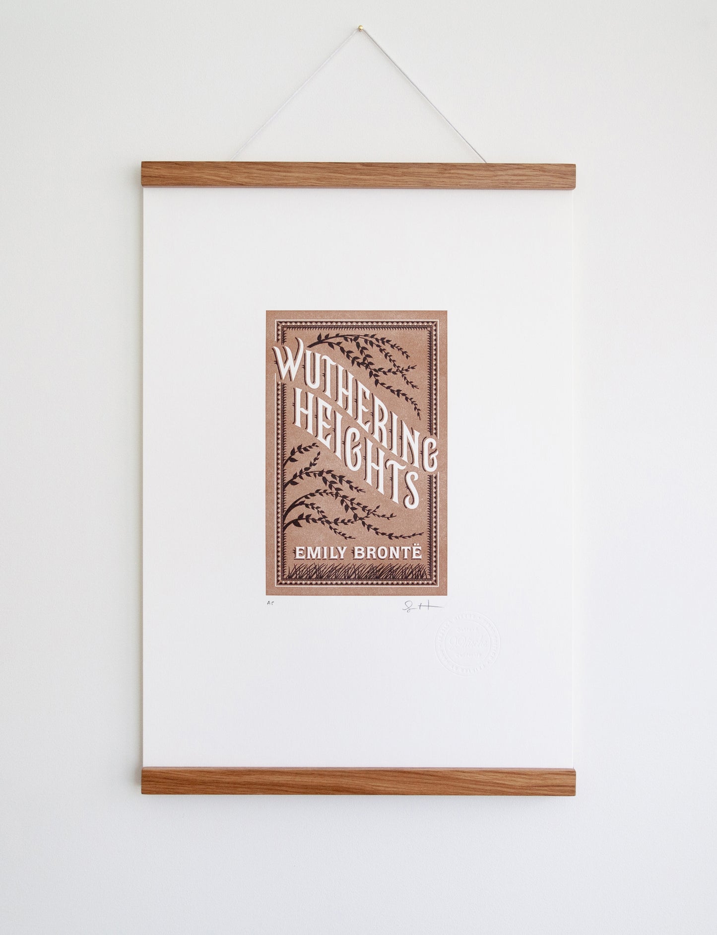 Framed 2-color letterpress print in brown and black. Printed artwork is an illustrated book cover of Wuthering Heights including custom hand lettering.